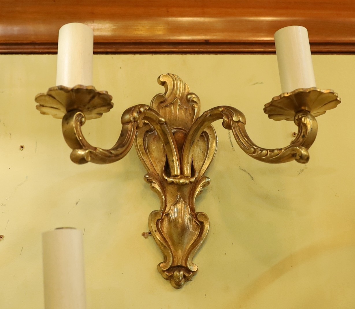 A pair of late 19th century French ormolu twin branch wall lights, height 21cm